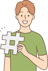 Smiling man with hashtag sign