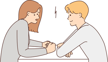 Couple with different moods sit at table