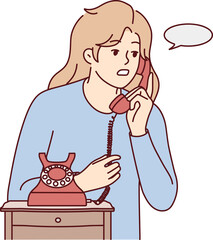 Young woman talk on landline phone
