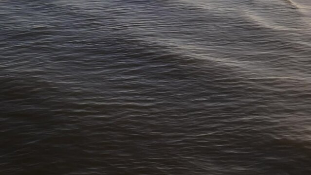 Water Waves Flow onto White Sand