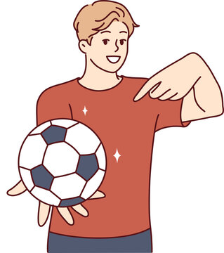 Young man holds soccer ball and points finger at it, offering to play football. Vector image