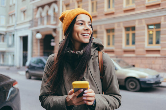 Attractive young woman tourist talking on mobile phone