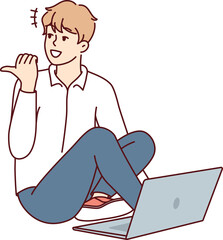 Man sitting on floor with laptop and looking back pointing finger doing online working. Vector image