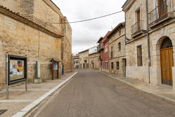 Fototapeta na wymiar a paved street with typical architecture in Castromonte town, province of Valladolid, Castile and Leon, Spain