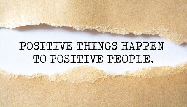 Positive Things Happen To Positive People. Words written under torn paper. Motivation concept text.