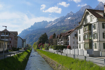 switzerland, an old house on the bank of a river in Switzerland, a house in the middle of the Swiss Alps