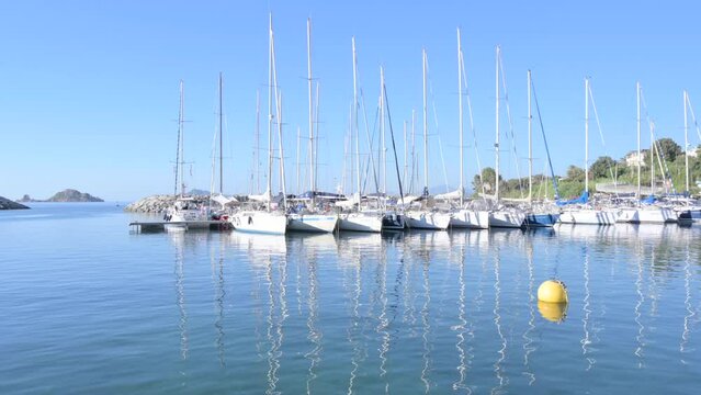 Small boat in the sea of sardinia. Luxury vacation. Embankment of Italy. travel on the waves. High quality 4k footage