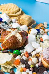 Unhealthy products. food bad for figure, skin, heart and teeth. Assortment of fast carbohydrates food with candy