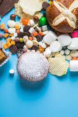 Unhealthy products. food bad for figure, skin, heart and teeth. Assortment of fast carbohydrates food with candy