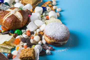 Unhealthy products. food bad for figure, skin, heart and teeth. Assortment of fast carbohydrates food with candy
