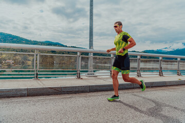 An athlete running a marathon and preparing for his competition. Photo of a marathon runner running in an urban environment