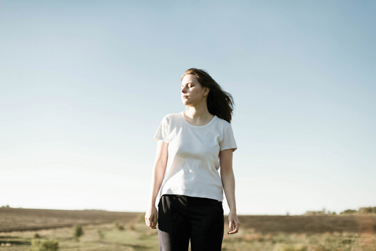 Dreamy portrait of a young brunette girl outdoor