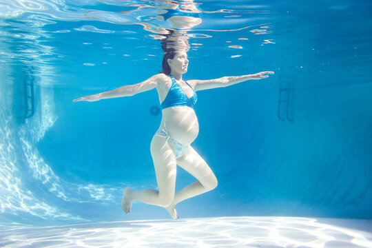 Pregnant woman in a pool.