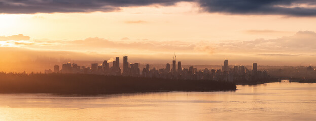 Modern City Skyline in Downtown Vancouver, British Columbia, Canada. Golden Winter Sunrise Sky.