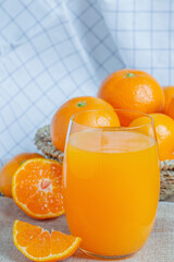 Orange juice and fresh oranges for health.