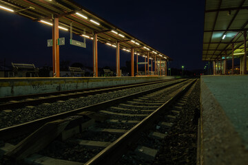 Fototapeta na wymiar View of tracks at the train station in Ronda at night