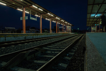 Fototapeta na wymiar View of tracks at the train station in Ronda at night