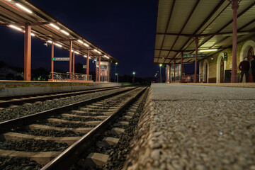 Fototapeta premium View of tracks at the train station in Ronda at night