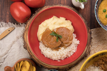 beef stew with mashed potatoes and rice Peru traditional comfort food buffet table