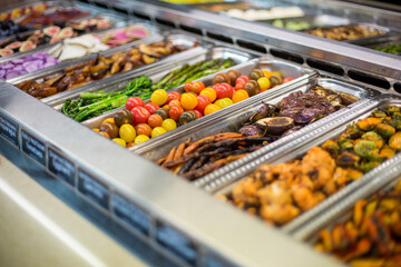 Variety of small and colorful baby heirloom tomatoes at a salad bar