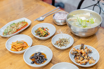 Soup and various side dishes at a Korean restaurant