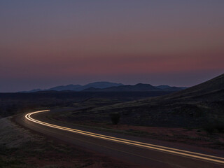 light trails with mountains
