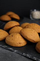 Delicious oatmeal cookies on grey table, closeup