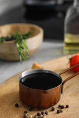 Organic balsamic vinegar and cooking ingredients on table