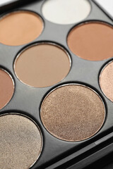 Beautiful eye shadow palette on table, closeup