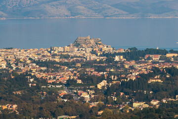 Corfu island view from Kaiser's Throne observation deck lookout, Pelekas village, Greece, Kaiser William II summit Observatory panoramic summer view with mountains, sea and Kerkyra in a background