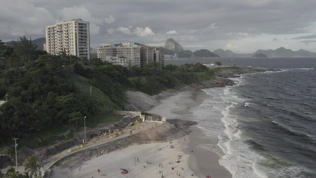 Aerial drone view of Praia do Diabo with Copacabana beach in the background in Rio de Janeiro, Brazil