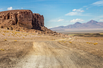 Dirt road in Moon Valley dramatic landscape at Sunset, Atacama Desert, Chile