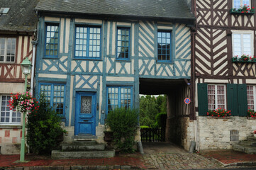 Historic Half-Timbered Houses In Beaumont-en-Auge Normandy France On An Overcast Summer Day