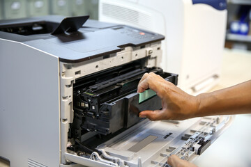 Technician hand open cover printer photocopier or photocopy to replace ink cartridges or fix paper...