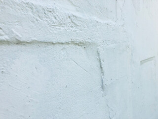 White stucco walls have rough surfaces.
