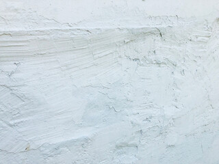White stucco walls have rough surfaces.