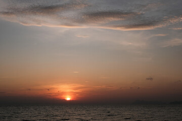 Naklejka na ściany i meble Tropical sunrise above the sea. Thailand.