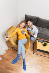 couple in love taking selfie smiling and having fun at home