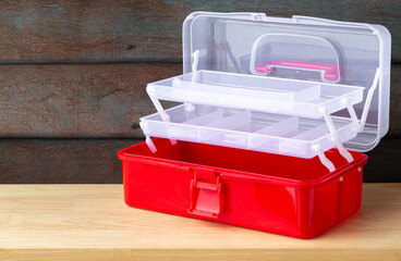 Large toolbox on wooden table isolated on white background.