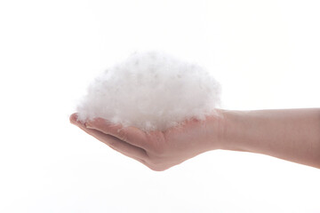 	
white down feathers hold in hand on white background