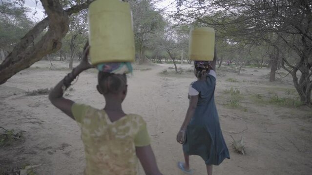 African Women Carrying Water