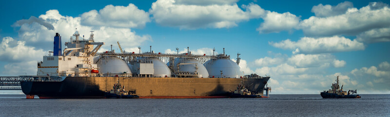 Fototapeta premium Oil and gas industry .Tanker for transportation of liquefied natural gas during mooring at the LNG marine terminal.