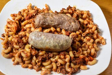 plate of american chop suey  with  sweet italian sausage