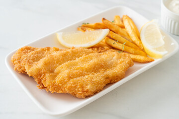 fish and chips - fried fish fillet with potatoes chips