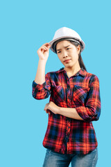 Young female engineer in helmet stand with thoughtful posture