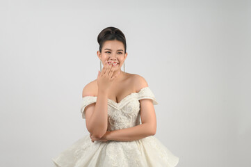 Fototapeta na wymiar Young asian beautiful bride smiling with happy on white background