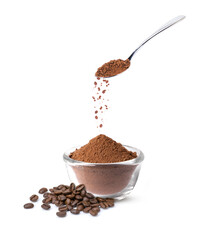 Pouring ground coffee or coffe powder from stainless teaspoon isolated on white background.