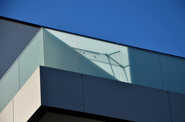 railing of a luxury house consisting of glass panels fastened with gray metal stainless steel...
