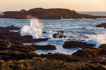 View of the volcanic shore of the Atlantic Ocean in the area of Essaouira in Morocco on a summer evening.