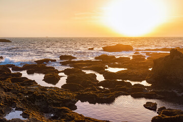 Obraz premium Sunset on the Atlantic Ocean in the area of Essaouira in Morocco on a summer evening.
